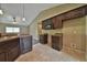 Kitchen boasts dark wood cabinets, granite countertops, and tile floors at 5230 Nw 56Th Ter, Ocala, FL 34482