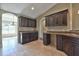 Spacious kitchen featuring dark wood cabinets and granite countertops at 5230 Nw 56Th Ter, Ocala, FL 34482