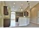 Open kitchen with a view to the living room and high ceilings at 5230 Nw 56Th Ter, Ocala, FL 34482