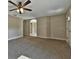 Spacious living room with carpeted floors and ceiling fan at 5230 Nw 56Th Ter, Ocala, FL 34482