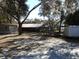 Large backyard with mature trees and a playset at 611 Sw Shorewood Dr, Dunnellon, FL 34431