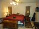 Spacious Primary bedroom with king-size bed and ceiling fan at 611 Sw Shorewood Dr, Dunnellon, FL 34431