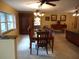 Spacious dining area with a large wooden table and chandelier at 611 Sw Shorewood Dr, Dunnellon, FL 34431