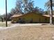 Another side view of the house, showing AC unit and trees at 611 Sw Shorewood Dr, Dunnellon, FL 34431
