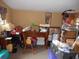 Small cluttered room with a wooden desk and various items at 611 Sw Shorewood Dr, Dunnellon, FL 34431