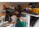 Cluttered room with various items and boxes at 611 Sw Shorewood Dr, Dunnellon, FL 34431