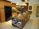 Large kitchen with granite countertops, island, and stainless steel appliances at 611 Sw Shorewood Dr, Dunnellon, FL 34431