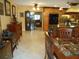 Kitchen with dining area and view into adjacent room at 611 Sw Shorewood Dr, Dunnellon, FL 34431