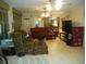 Relaxing living room with comfy seating and a large TV at 611 Sw Shorewood Dr, Dunnellon, FL 34431
