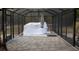 Screened porch with covered grill and stone patio at 611 Sw Shorewood Dr, Dunnellon, FL 34431
