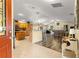 View of the kitchen and living area from the entryway at 637 Arteaga Way, The Villages, FL 32162