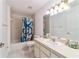 Clean bathroom with tub shower and vanity at 7854 Sw 62Nd Ct, Ocala, FL 34476