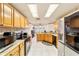 Spacious kitchen with ample cabinetry and tile countertops at 7854 Sw 62Nd Ct, Ocala, FL 34476