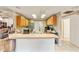 Open kitchen with breakfast bar and access to adjacent living space at 7854 Sw 62Nd Ct, Ocala, FL 34476