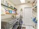 Laundry room with washer, dryer, and ample storage shelving at 7854 Sw 62Nd Ct, Ocala, FL 34476