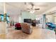 Spacious living room with tiled floor and access to sunroom at 7854 Sw 62Nd Ct, Ocala, FL 34476