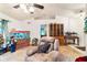 Living area with tiled floors, recliner, and a large aquarium at 7854 Sw 62Nd Ct, Ocala, FL 34476