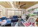 Relaxing sunroom with two sofas, a chair, and a small aquarium at 7854 Sw 62Nd Ct, Ocala, FL 34476