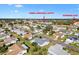 Aerial view of home,community pool, and tennis courts at 9862 Se 179Th Pl, Summerfield, FL 34491