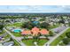 Community clubhouse with adjacent pool and parking at 9862 Se 179Th Pl, Summerfield, FL 34491