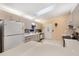 Modern kitchen featuring white cabinetry and speckled countertops at 9862 Se 179Th Pl, Summerfield, FL 34491