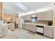 Well-lit kitchen with updated countertops and appliances at 9862 Se 179Th Pl, Summerfield, FL 34491