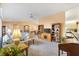 Open concept living room with a view into the dining area at 9862 Se 179Th Pl, Summerfield, FL 34491