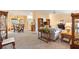 Bright living room with light colored furniture and carpeting at 9862 Se 179Th Pl, Summerfield, FL 34491