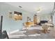 Open living room with view into kitchen and dining area at 9862 Se 179Th Pl, Summerfield, FL 34491