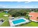 Community swimming pool with surrounding lounge area at 9862 Se 179Th Pl, Summerfield, FL 34491