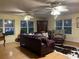 Spacious living room with leather furniture and wood floors at 11064 Ne 212Th Ln, Fort Mc Coy, FL 32134