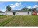 View of the backyard, showing a large grassy area at 13457 Sw 107Th Pl, Dunnellon, FL 34432