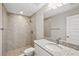 Clean bathroom with a shower and granite vanity at 13457 Sw 107Th Pl, Dunnellon, FL 34432