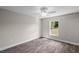 Spacious bedroom with wood-look floors and a ceiling fan at 13457 Sw 107Th Pl, Dunnellon, FL 34432