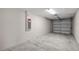 Attached garage with concrete floor and overhead door at 13457 Sw 107Th Pl, Dunnellon, FL 34432