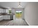 Kitchen with white cabinets, granite countertops, and stainless steel appliances at 13457 Sw 107Th Pl, Dunnellon, FL 34432