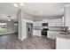 Modern kitchen with stainless steel appliances and granite countertops at 13457 Sw 107Th Pl, Dunnellon, FL 34432