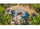 Aerial view of house with solar panels and screened pool at 13780 Sw 78Th Pl, Dunnellon, FL 34432