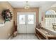 Bright and airy entryway with decorative wreath and console table at 2462 Nw 53 Ave Rd, Ocala, FL 34482