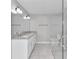 Bathroom with double vanity, granite countertop and a large glass shower at 2809 Ne 43Rd Rd, Ocala, FL 34470