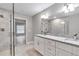 Elegant bathroom with double vanity, granite countertop, and a walk-in shower at 2809 Ne 43Rd Rd, Ocala, FL 34470