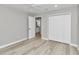 Bright bedroom with ceiling fan, vinyl flooring, and a large closet at 2809 Ne 43Rd Rd, Ocala, FL 34470