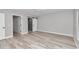 Spacious bedroom with wood-look floors and an ensuite bathroom at 2809 Ne 43Rd Rd, Ocala, FL 34470
