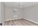 Well-lit bedroom with ceiling fan, vinyl flooring and window coverings at 2809 Ne 43Rd Rd, Ocala, FL 34470