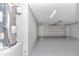 Attached garage with painted floor and water heater at 2809 Ne 43Rd Rd, Ocala, FL 34470