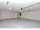 Clean and bright garage featuring epoxy flooring and laundry area access at 2809 Ne 43Rd Rd, Ocala, FL 34470