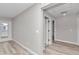 Light and bright hallway with vinyl flooring and access to other rooms at 2809 Ne 43Rd Rd, Ocala, FL 34470