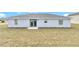 Back of house showing patio and yard at 2809 Ne 43Rd Rd, Ocala, FL 34470