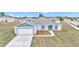 Newly built home with a garage and yard at 2809 Ne 43Rd Rd, Ocala, FL 34470