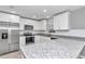 Modern kitchen featuring stainless steel appliances and granite countertops at 2809 Ne 43Rd Rd, Ocala, FL 34470